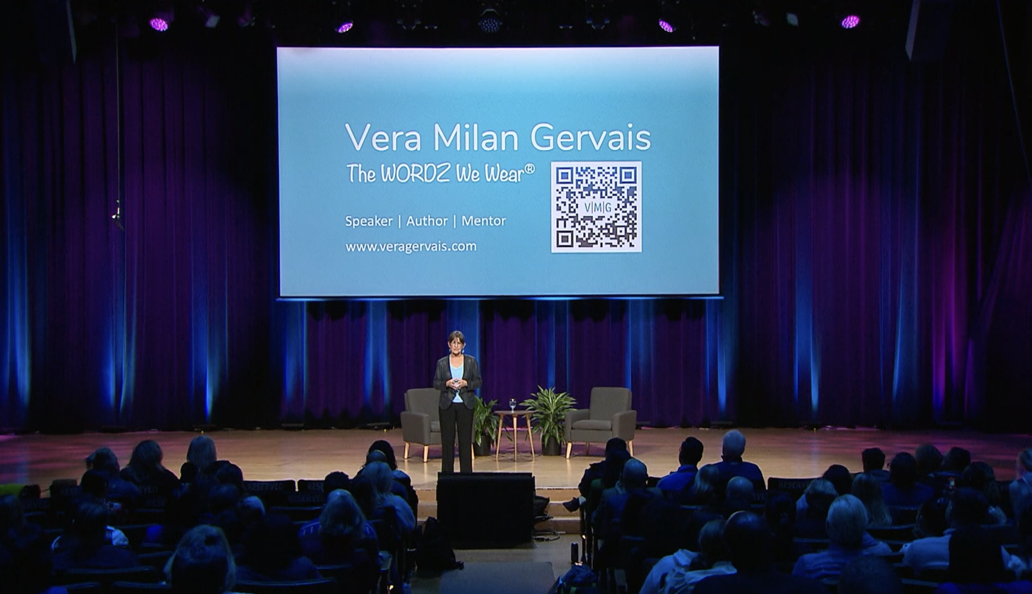 Vera speaking on stage at Millionaire